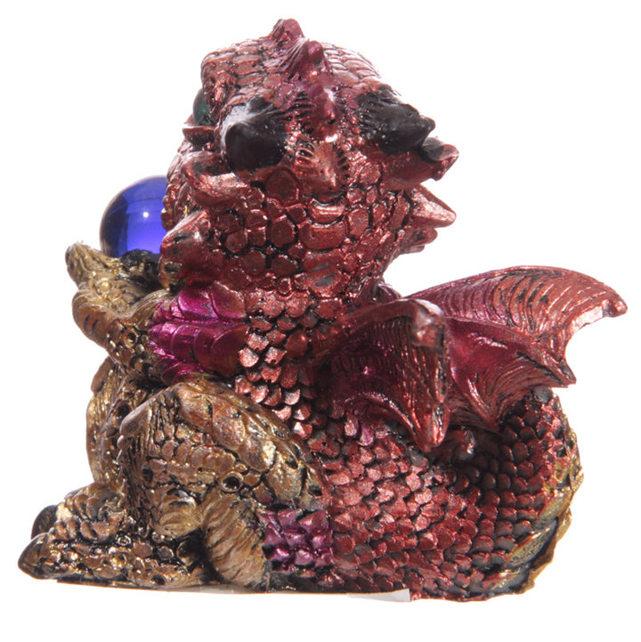 baby dragon with crystal ball figurine